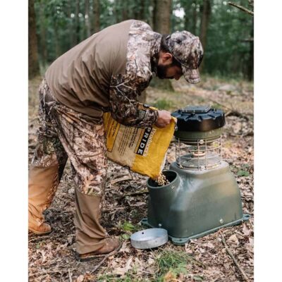 Man filling the 100LB Capsule Feeder