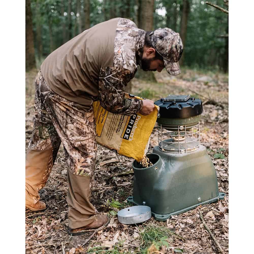 Man filling the 100LB Capsule Feeder