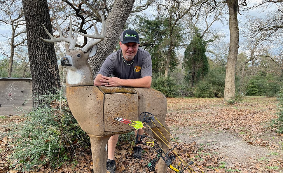 GlenDel guy showing off his shots on a stationary deer target